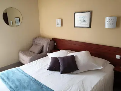 Un ou plusieurs lits dans un hébergement de l'établissement Hotel Restaurant Les Oceanides