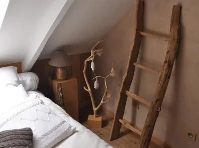 Un ou plusieurs lits dans un hébergement de l'établissement L'herbe des nuits...