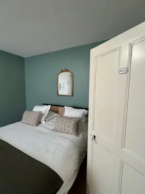 Un ou plusieurs lits dans un hébergement de l'établissement Le Clos Du Pontic Logis et Cit'Hotel