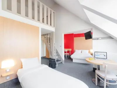 Un ou plusieurs lits dans un hébergement de l'établissement B&B HOTEL Quimper Sud Bénodet