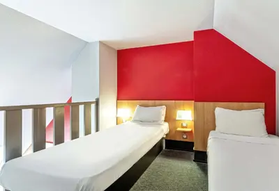 Un ou plusieurs lits dans un hébergement de l'établissement B&B HOTEL Quimper Sud Bénodet