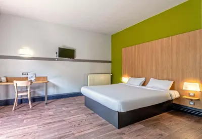 Un ou plusieurs lits dans un hébergement de l'établissement B&B HOTEL Quimper Sud Bénodet