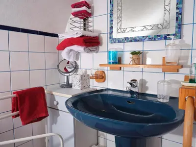 Salle de bains dans l'établissement Les Roses