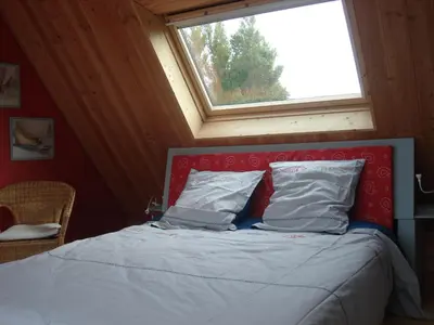Un ou plusieurs lits dans un hébergement de l'établissement Cosmeur B&B