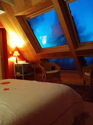Un ou plusieurs lits dans un hébergement de l'établissement Cosmeur B&B