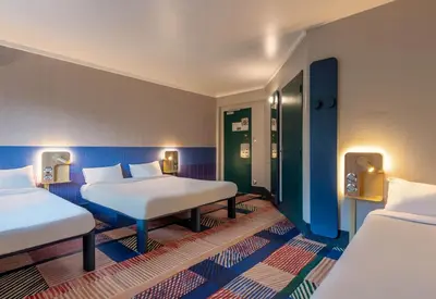 Un ou plusieurs lits dans un hébergement de l'établissement B&B HOTEL Brest Port du Moulin Blanc
