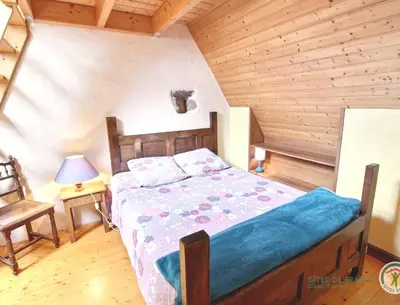 Un ou plusieurs lits dans un hébergement de l'établissement Maison charmante à Trédrez-Locquémeau avec jardin et terrasse
