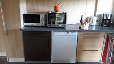 Cuisine ou kitchenette dans l'établissement Le Chant Des Mûres