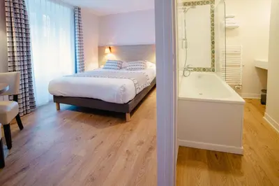 Un ou plusieurs lits dans un hébergement de l'établissement Grand Hôtel de l'Europe - Morlaix Centre