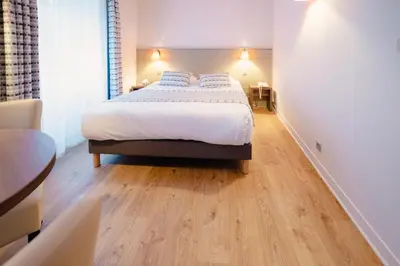 Un ou plusieurs lits dans un hébergement de l'établissement Grand Hôtel de l'Europe - Morlaix Centre