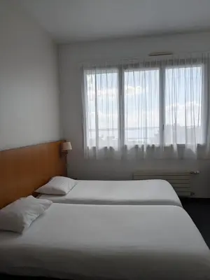 Un ou plusieurs lits dans un hébergement de l'établissement Hotel de la Gare Brest