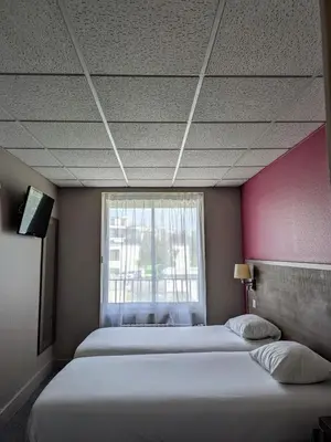 Un ou plusieurs lits dans un hébergement de l'établissement Hotel de la Gare Brest