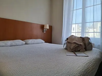 Un ou plusieurs lits dans un hébergement de l'établissement Hotel de la Gare Brest