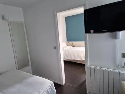 Un ou plusieurs lits dans un hébergement de l'établissement Kyriad Quimper Sud