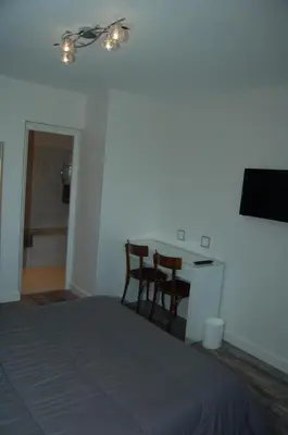 Un ou plusieurs lits dans un hébergement de l'établissement Le Relais des Primeurs LOGIS HOTEL