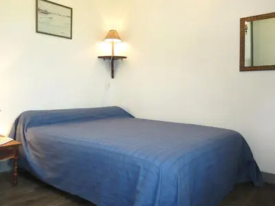 Un ou plusieurs lits dans un hébergement de l'établissement Holiday Home Les Embruns by Interhome