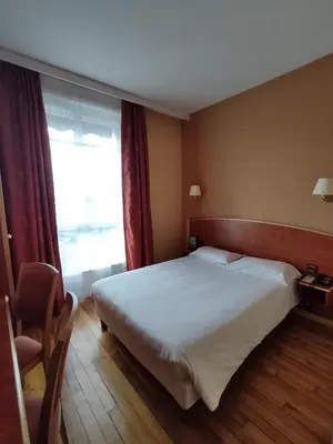 Un ou plusieurs lits dans un hébergement de l'établissement Hôtel Vauban