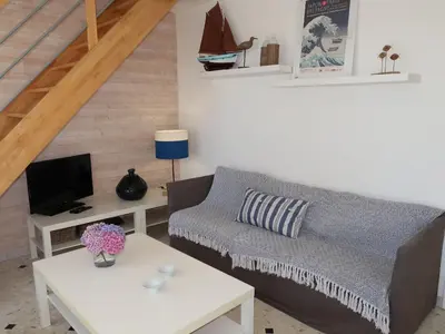Coin salon dans l'établissement Holiday Home Partie de pêche by Interhome