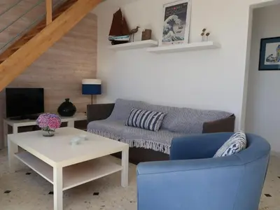 Coin salon dans l'établissement Holiday Home Partie de pêche by Interhome