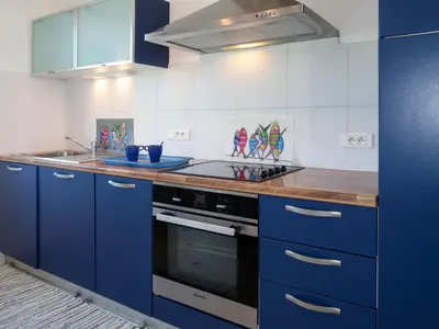 Cuisine ou kitchenette dans l'établissement Holiday Home Partie de pêche by Interhome