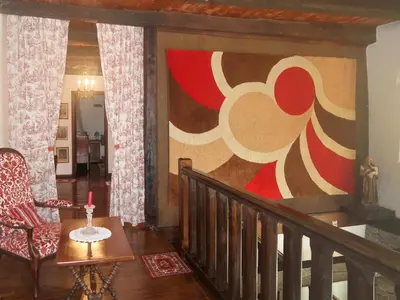 Coin salon dans l'établissement Holiday Home Le Manoir by Interhome
