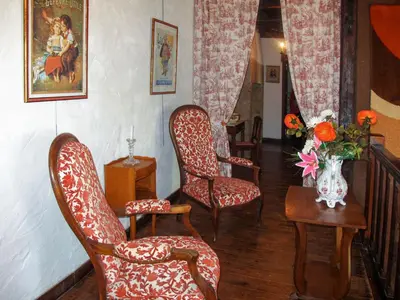 Coin salon dans l'établissement Holiday Home Le Manoir by Interhome