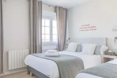 Un ou plusieurs lits dans un hébergement de l'établissement Hotel du Centre - Chez Janie