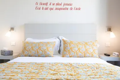 Un ou plusieurs lits dans un hébergement de l'établissement Hotel du Centre - Chez Janie