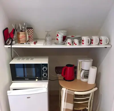 Cuisine ou kitchenette dans l'établissement Les Coquelicots