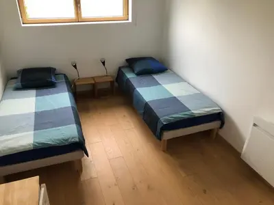 Un ou plusieurs lits dans un hébergement de l'établissement Maison près des plages