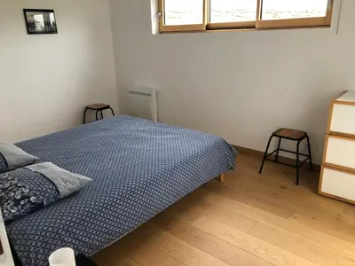 Un ou plusieurs lits dans un hébergement de l'établissement Maison près des plages