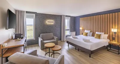 Un ou plusieurs lits dans un hébergement de l'établissement Best Western Côte des Sables Plouescat
