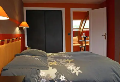 Un ou plusieurs lits dans un hébergement de l'établissement Hostellerie De La Mer