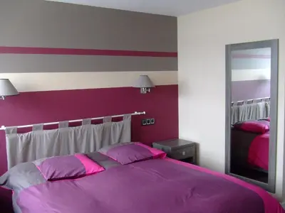 Un ou plusieurs lits dans un hébergement de l'établissement Hostellerie De La Mer