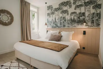 Un ou plusieurs lits dans un hébergement de l'établissement L'Armoric Hôtel - Logis hôtel - RÉNOVÉ