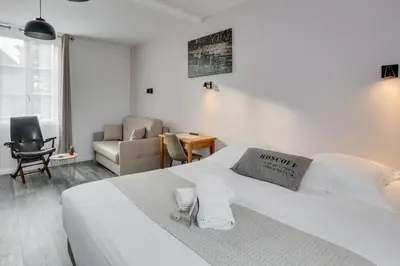Un ou plusieurs lits dans un hébergement de l'établissement Hotel D'Angleterre