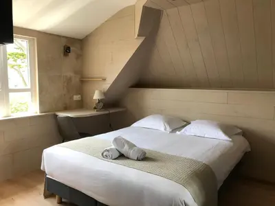 Un ou plusieurs lits dans un hébergement de l'établissement Hotel D'Angleterre