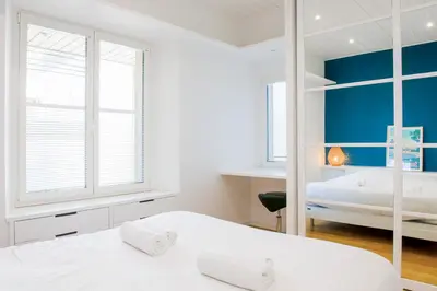 Un ou plusieurs lits dans un hébergement de l'établissement Appartement sainte marine vue mer