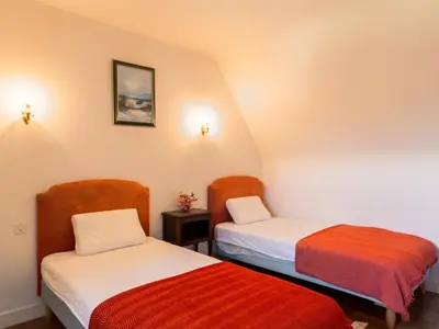 Un ou plusieurs lits dans un hébergement de l'établissement Holiday Home Blaue Hortensie by Interhome