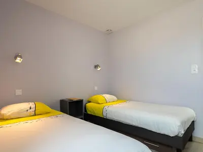 Un ou plusieurs lits dans un hébergement de l'établissement Apartment Les Chardons Bleus 2 by Interhome