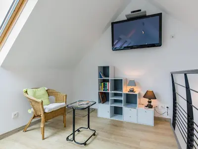 Télévision ou salle de divertissement dans l'établissement Holiday Home Brise Marine by Interhome
