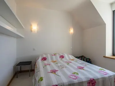 Un ou plusieurs lits dans un hébergement de l'établissement Holiday Home Men Meur by Interhome