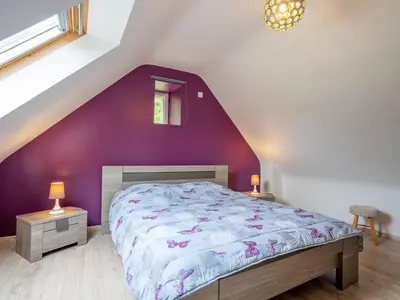 Un ou plusieurs lits dans un hébergement de l'établissement Holiday Home Gîte des Perdrix by Interhome