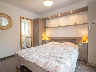 Un ou plusieurs lits dans un hébergement de l'établissement Holiday Home Gîte des Perdrix by Interhome