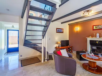Télévision ou salle de divertissement dans l'établissement Holiday Home Du Bout du Monde by Interhome
