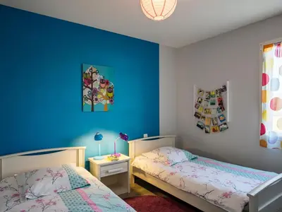 Un ou plusieurs lits dans un hébergement de l'établissement Holiday Home La Goulvinoise by Interhome