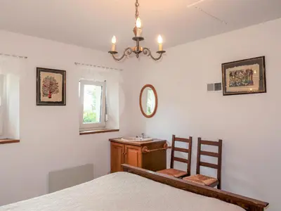 Un ou plusieurs lits dans un hébergement de l'établissement Holiday Home Ty Coz by Interhome