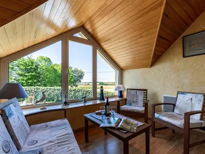 Coin salon dans l'établissement Holiday Home Ty Channed by Interhome