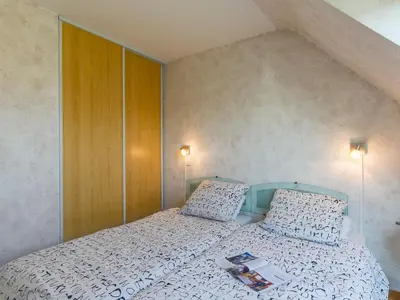 Un ou plusieurs lits dans un hébergement de l'établissement Holiday Home L'Hermine by Interhome