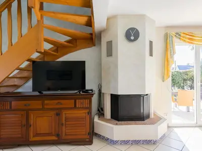 Télévision ou salle de divertissement dans l'établissement Holiday Home L'Hermine by Interhome